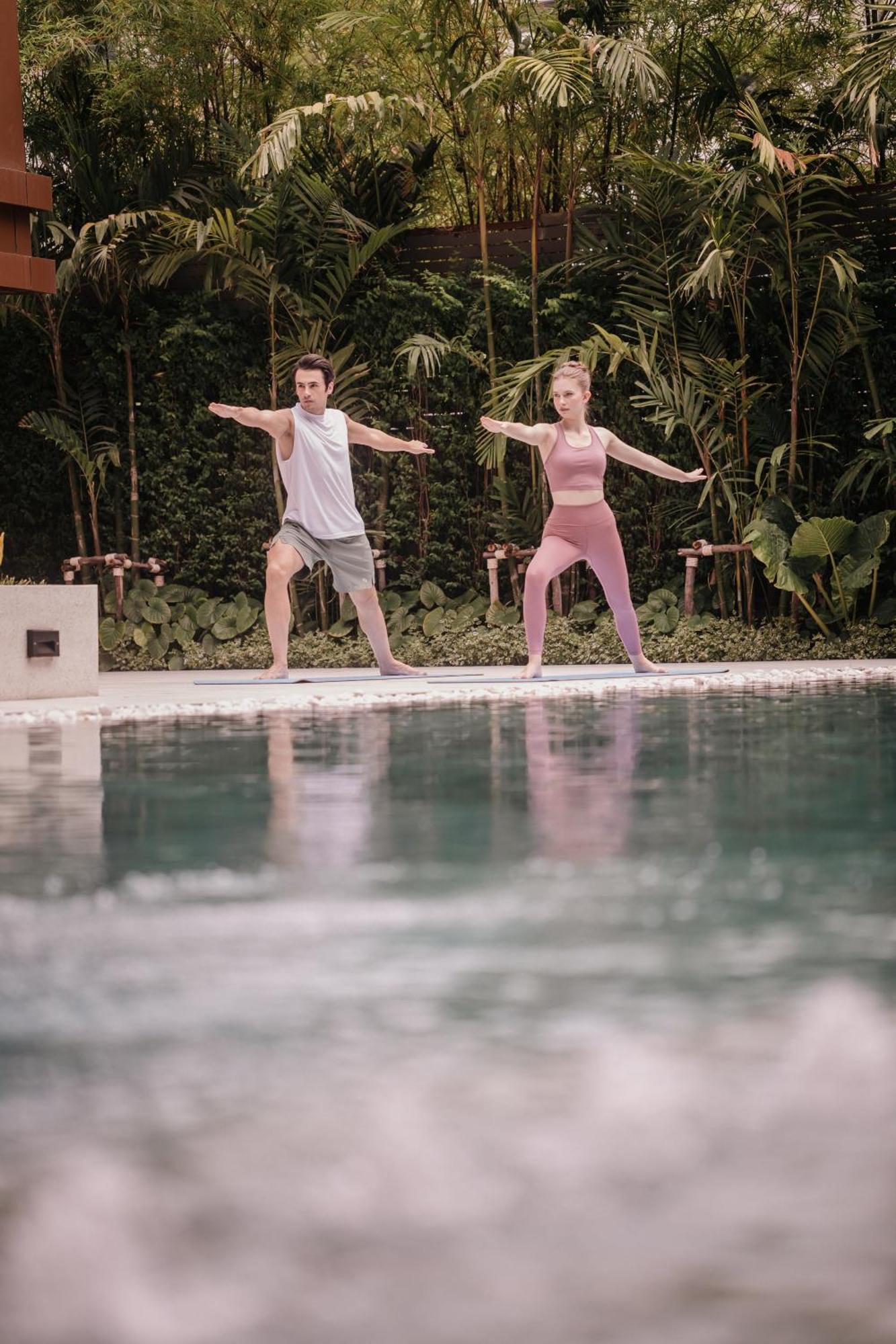 Nysa Hotel Bangkok Sukhumvit 11 외부 사진 A couple practicing yoga